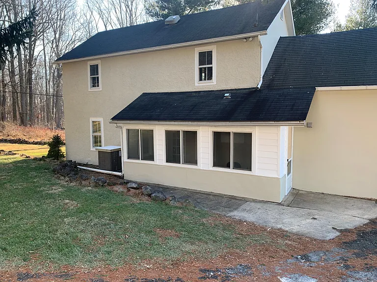 Back of house with screened porch