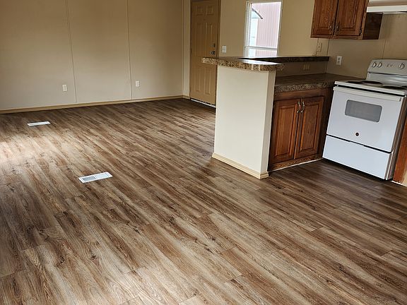 Entry to kitchen and dining room. Leading to living room