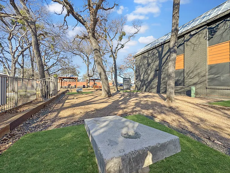Enjoy the outdoors with shaded picnic areas surrounded by mature trees.