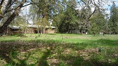 Backyard and house from the creek area