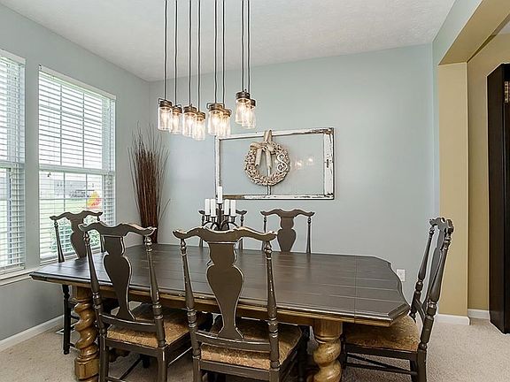 Lovely Dining Room. One of several rooms with tastefully updated lighting.