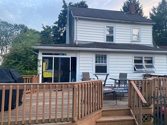 Back, sliding glass door from sunroom exits to deck