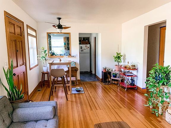 Front room with living and dining spaces, opening to the kitchen