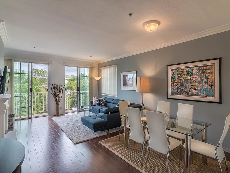 LARGE LIVING ROOM AND DINING AREA WITH A FIRE PLACE