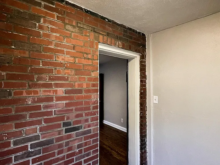 Side room adjacent to the bedroom facing entry door.