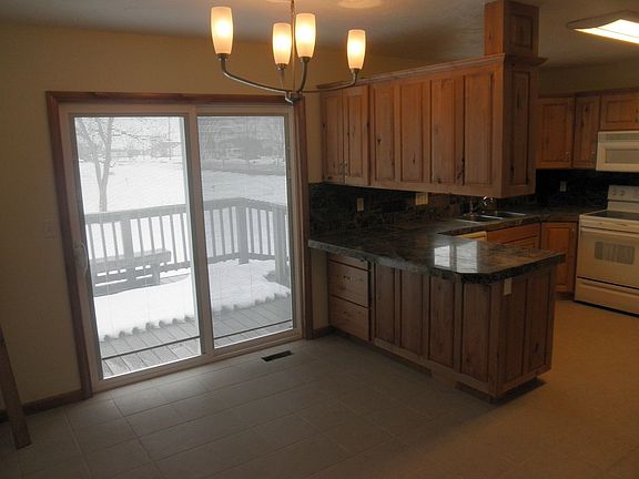 Rustic Alder Cabinets and sliding glass door