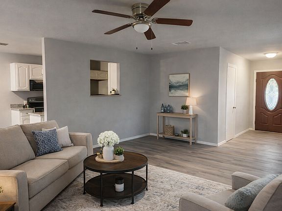 Virtually staged image. Furniture and decor shown are digital renderings for illustrative purposes only. Home is currently vacant.