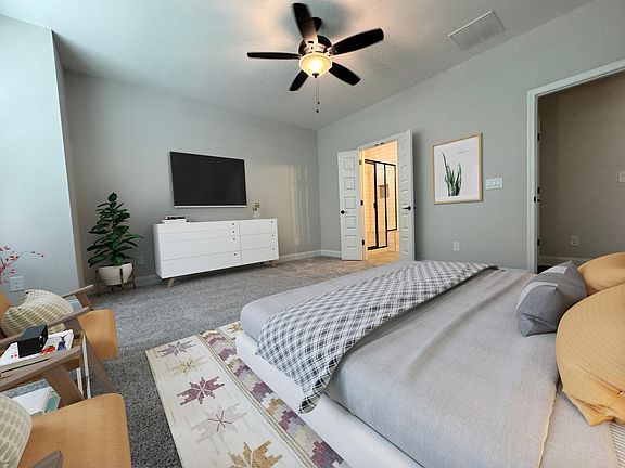 Furnished master bedroom with on-suite