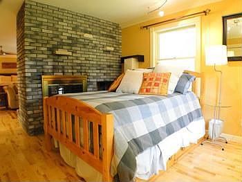 Another view of the master bedroom with a two way fireplace and private office area or nursery