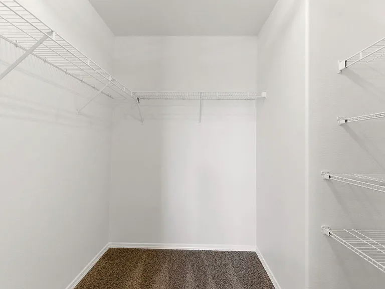 Huge walk in closet in master bedroom