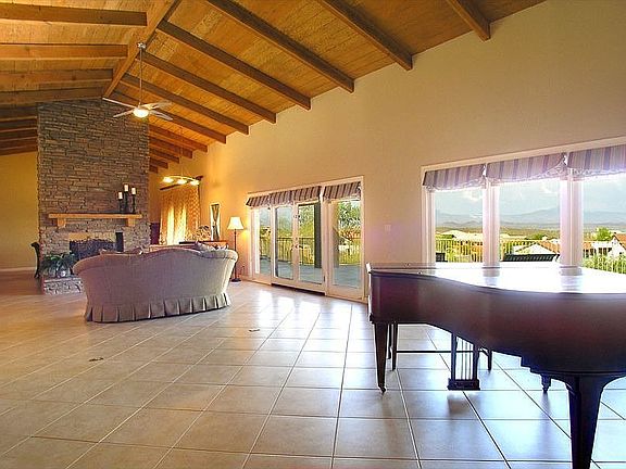 Panoramic Mountain/Desert views out back, soaring wood cathedral ceiling in!