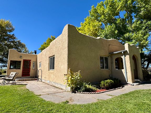 Exterior front of Adobe house