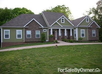 Front of house
						:
						Sorry - the dog does not come with the house :)