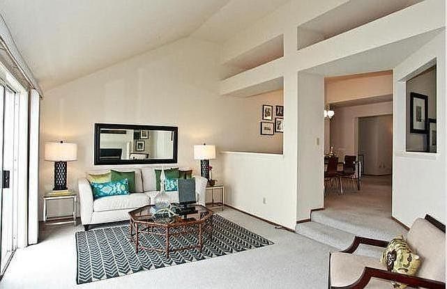 Spacious sunken Living Room w/ vaulted ceilings