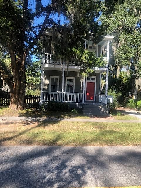 view of front of house, porches on both floors.