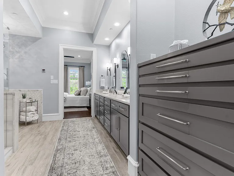 Ultimate relaxation awaits with a deep soaking tub and a modern glass shower.