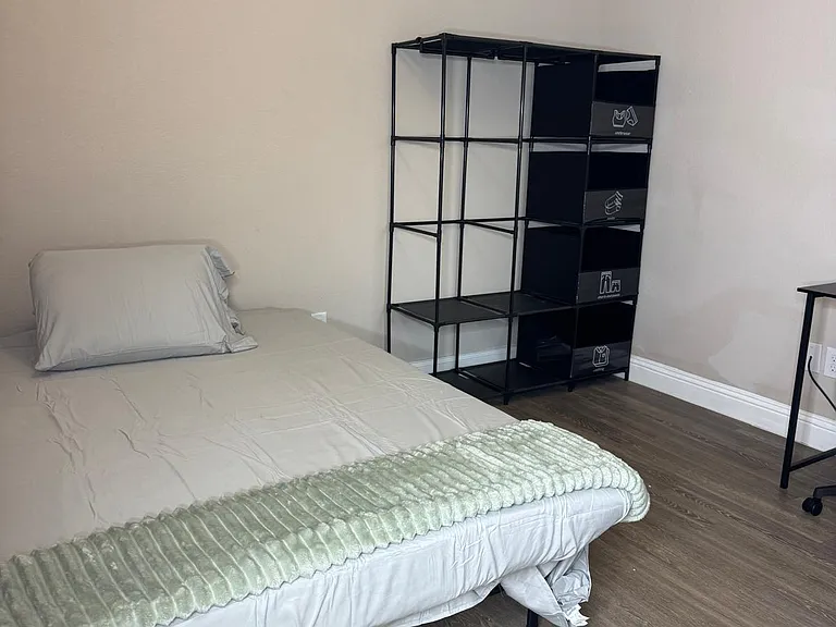 Fully furnished with a cozy bed, a sleek desk for work or study, and a roomy closet to keep everything organized.