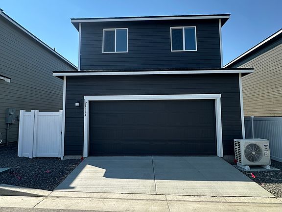 Back entrance through the two car garage with gate into your side yard