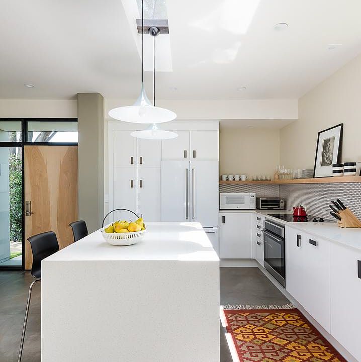 This is the kitchen as seen from the dining area. There is room to sit at the island for casual meals and morning coffee.