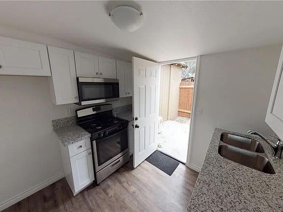 Spacious kitchen with plenty of storage, microwave & stove, includes dishwasher.