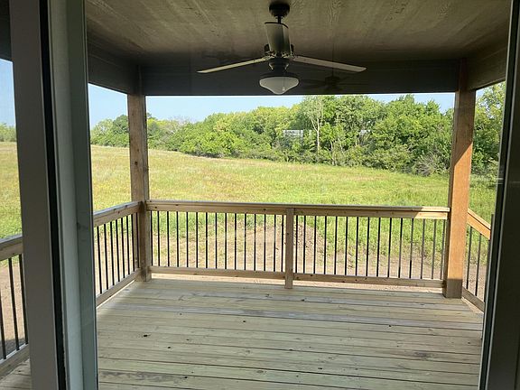 Covered Deck overlooking over sized yard and green space