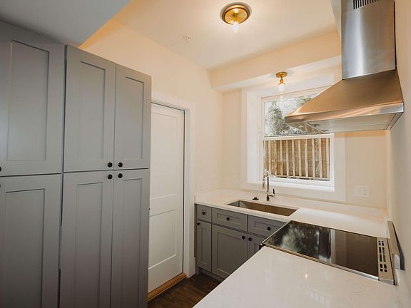 Custom cabinetry, white stone countertops