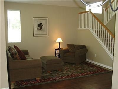 Beautiful laminate flooring, tastefull colors in formal living room.