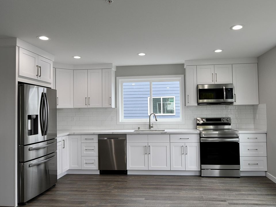 White Kitchen with Samsung stainless steel appliances. Unit 3&4