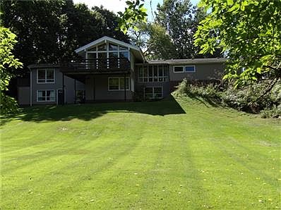 Beautiful back yard, mature trees & landscaped. Enjoy the view & 2 large wood decks & walk out basement.