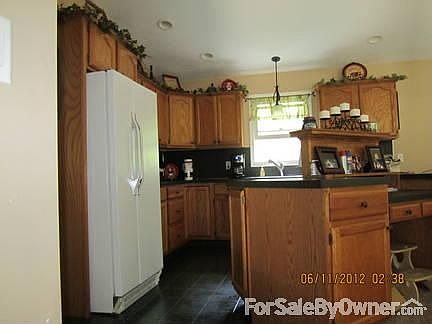 Kitchen - Main Floor
						:
						Beautiful Oak Cabinets - Plenty of cabinet space