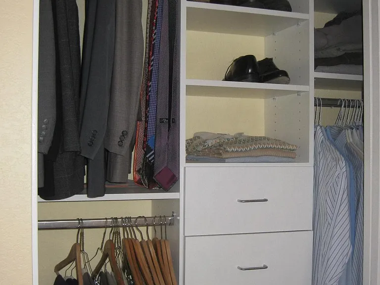 Clean custom made shelves inside your custom made mirror closet