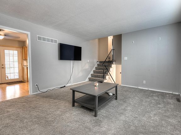 Living room opens into breakfast area
