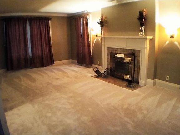 Very spacious formal LR with brand new carpet. The wood burning fireplace is enhanced with a tile hearth and a terrific wood mantle.