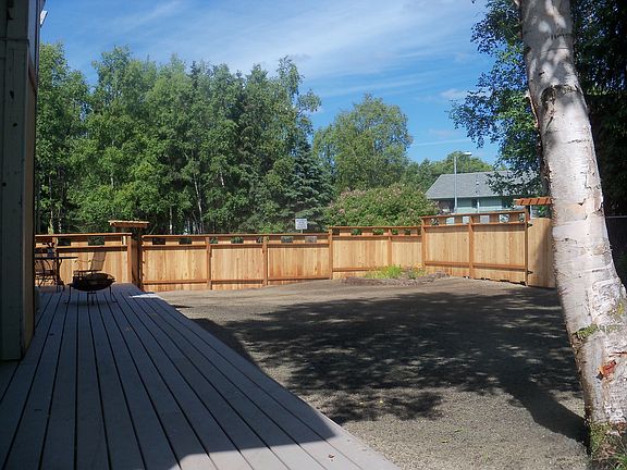 In-yard view of new fence, grass is now fully mature