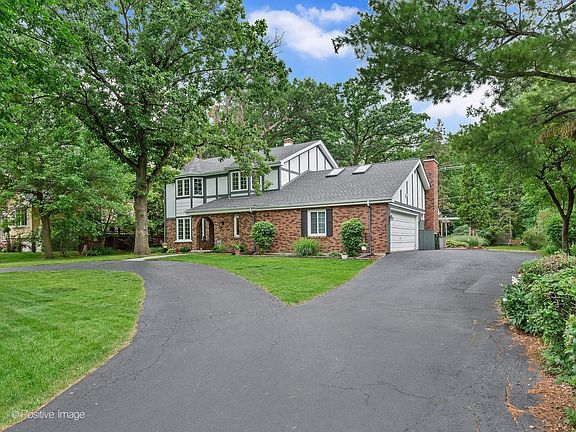 Circular driveway with 2-car attached garage.
