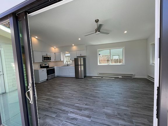 view from patio doors into open kitchen/living area.