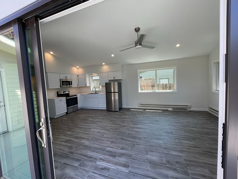 view from patio doors into open kitchen/living area.
