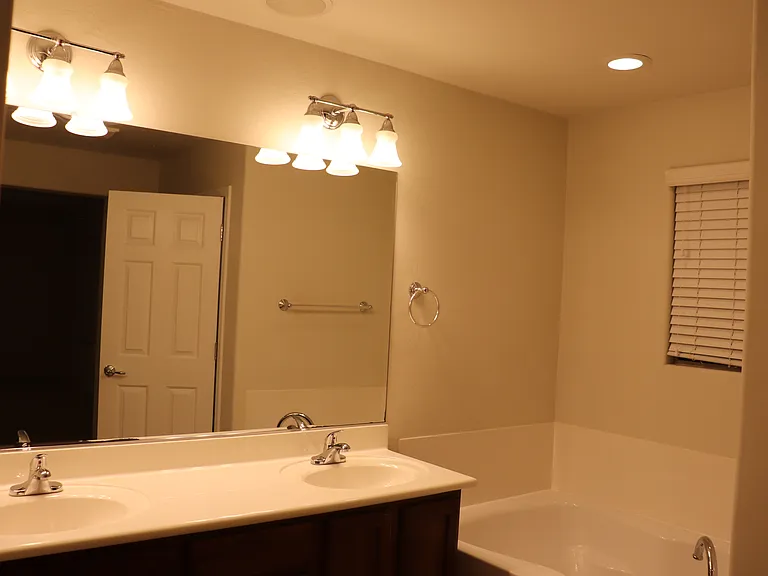 Master bathroom with a private bathtub