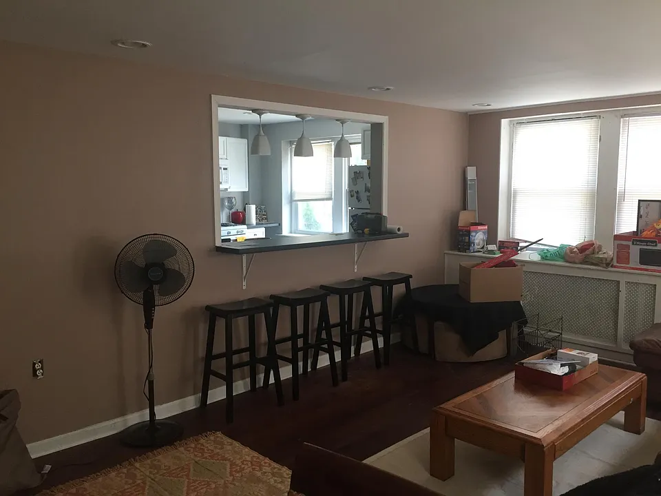 Living room with opening to kitchen