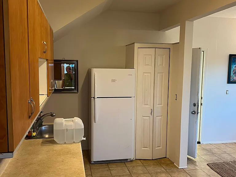 Downstairs Kitchen area with cupboards & countertops