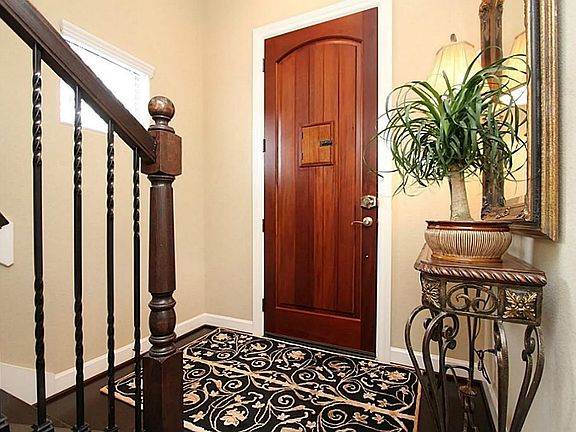 Enter through the custom door midway between first and 2nd level