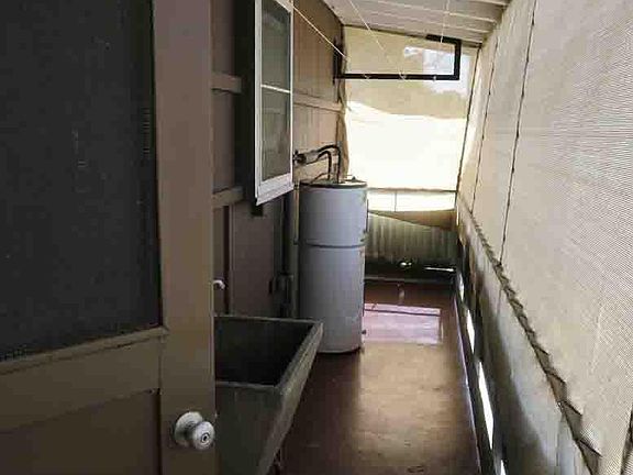 Enclosed lanai with clothes line. Washer hookup available