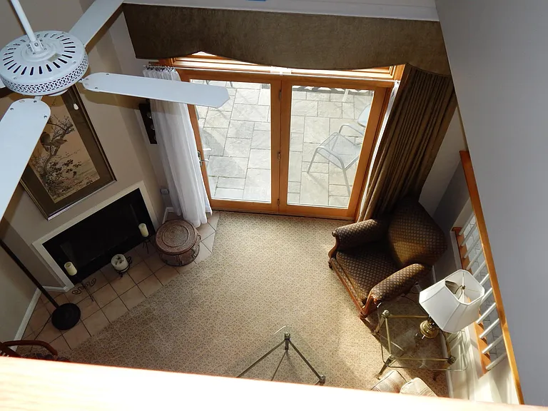 view from 2nd floor loft. Plush padded Milliken carpet through hallways, living room, split staircase, loft.