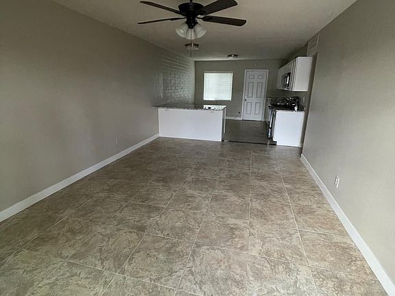 Spacious and cozy open-concept living, dining and kitchen.