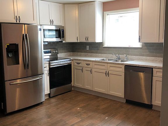 New cabinetry with self closing doors, ceramic flooring, new