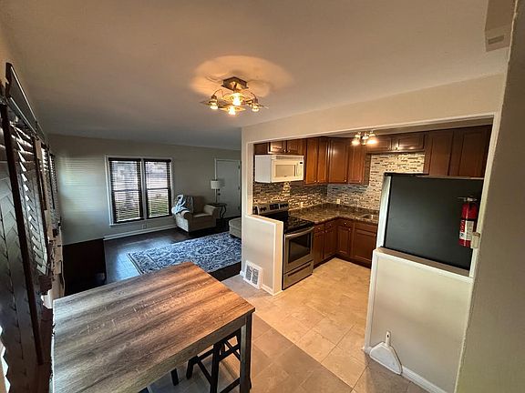New Porcelain tile in kitchen/dining area, newer stainless-steel appliances.