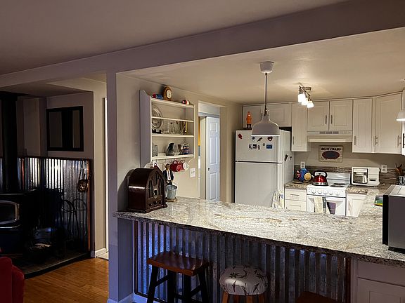 Updated kitchen with granite countertops.