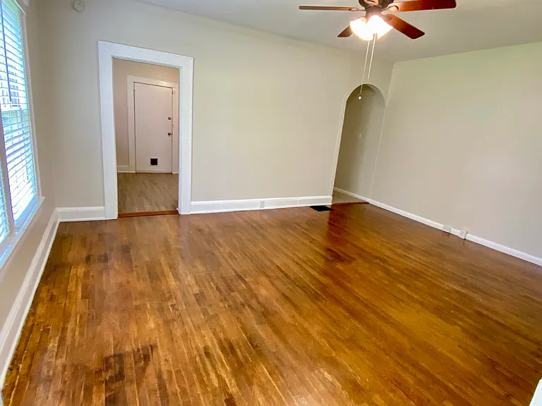 Large living room with original hardwood floors