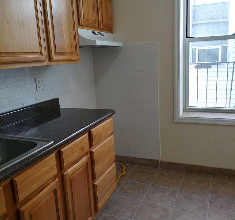 Angle of modern kitchen with brand new stove to be delivered today