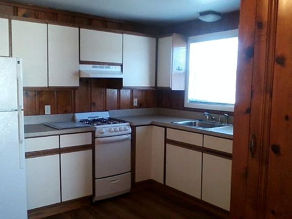 Kitchen with lots of cabinets and small pantry.